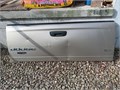 Tailgate for 2005 Dodge Ram TanGold color has a good size dent but in good condition otherwise
